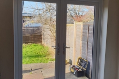 uPVC French door installation with clear glass in Tadley