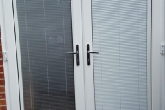 uPVC French door installation with blinded glass